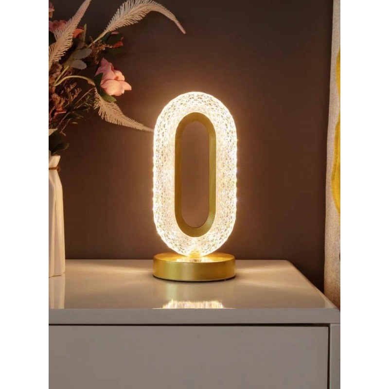 Une lampe de table LED merveilleusement conçue avec trois niveaux de couleurs pour l'éclairage nocturne de la chambre. Un design